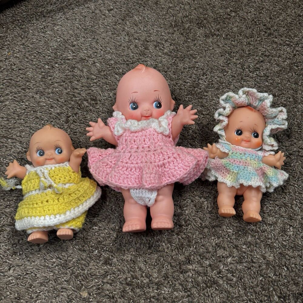 Lot of 3 vintage Kewpie dolls measuring approximately 12”, 8”, and 8”.